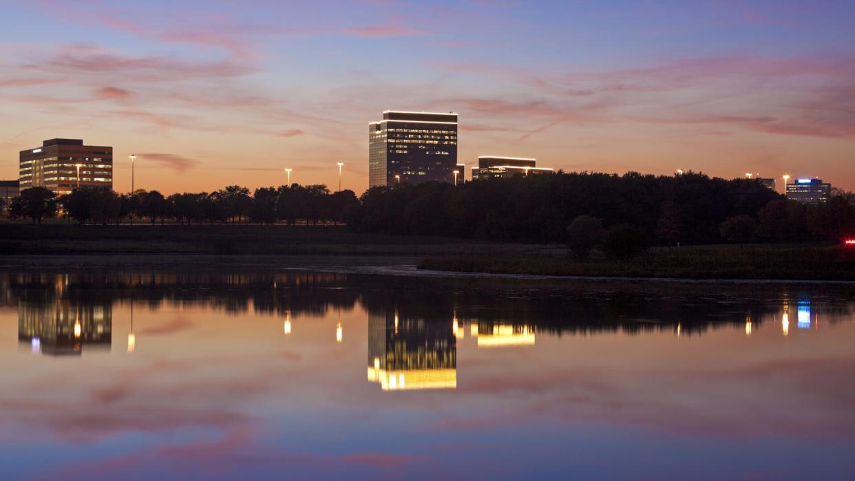 Schaumburg, Illinois - office buildings reflected in the lake.