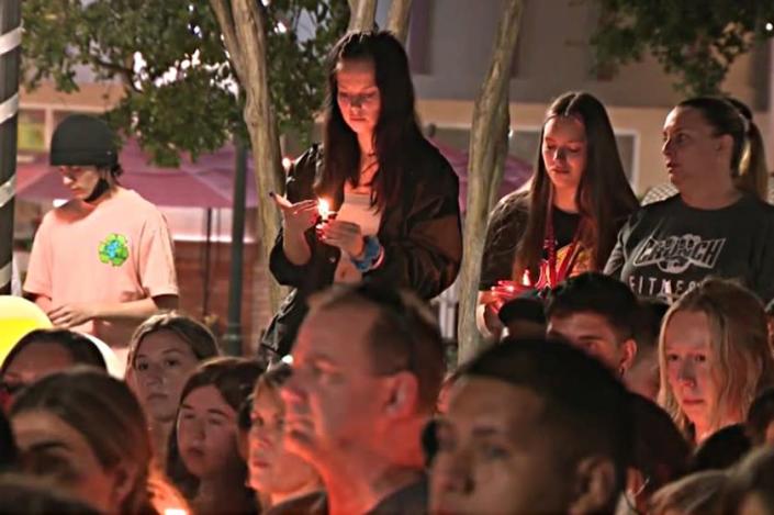 On Saturday night, hours after Abthony Barajas was declared dead, hundreds gathered for a candlelight vigil outside the Corona movie theater where the teens were shot.