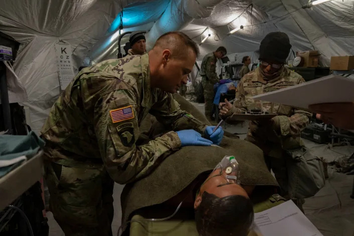 Soldiers at an Army field hospital prepare simulated casualties for transport at Sierra Army Depot, California, during an exercise, Oct. 29, 2019. (Spc. ShaTyra Reed/Army)