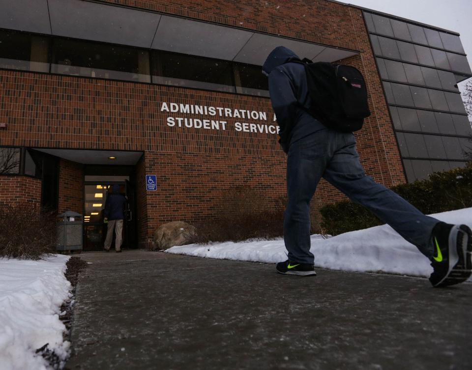 Students walk into the Administration and Student Services building at Oakland Community College campus in Auburn Hills on March 5, 2014. State officials estimate an additional 350,000 Michigan residents will be eligible for tuition-free community college enrollment thanks to an expansion of eligibility for the Michigan Reconnect program in the state's 2023-24 fiscal year budget.