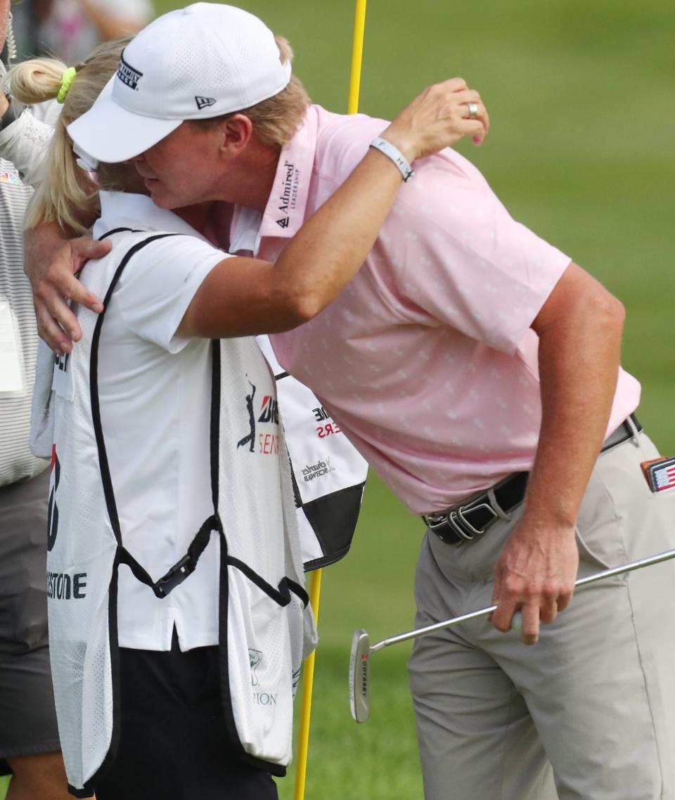Steve Stricker hugs his wife and caddie Nicki after winning  the Bridgestone Senior Players Championship at Firestone Country Club on Friday June 27, 2021 in Akron.