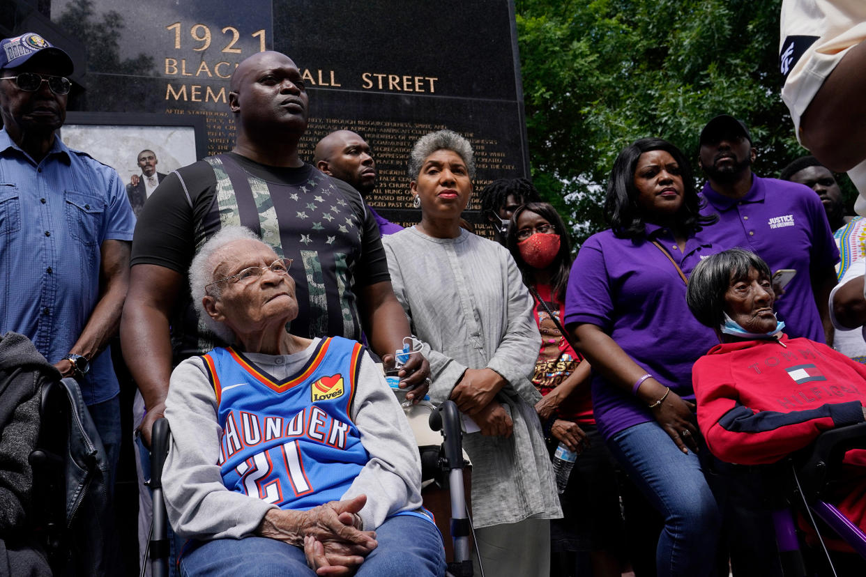 Tulsa race massacre survivors Viola Fletcher, left, and Lessie Benningfield Randle, right, listen during a rally marking centennial commemorations in Tulsa, Okla., May 28, 2021.