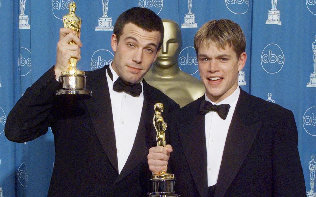 Matt Damon and Ben Affleck with their Oscars for Good Will Hunting in 1998