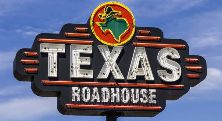 An outside and closeup view of a Texas Roadhouse, Inc. (TXRH) sign