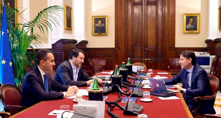 From left: Five Star chief Luigi Di Maio and League leader Matteo Salvini meet with Giuseppe Conte, their approved pick for prime minister before he stepped aside