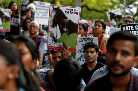 People attend a protest against the rape of an eight-year-old girl, in Kathua, near Jammu and a teenager in Unnao, Uttar Pradesh state, in New Delhi, India April 15, 2018. REUTERS/Cathal McNaughton