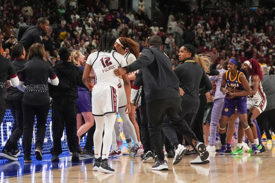 Mar 10, 2024; Greensville, SC, USA; A scrum erupts on court that would lead to multiple ejections in the final minutes between the South Carolina Gamecocks and the LSU Lady Tigers during the second half at Bon Secours Wellness Arena. Mandatory Credit: Jim Dedmon-USA TODAY Sports