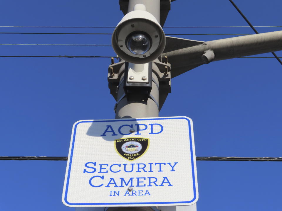 A security camera faces down on a street corner in Atlantic City, N.J., on Nov. 16, 2023. The city plans to add hundreds of additional security cameras to the 3,000 that already keep an electronic eye on the seaside gambling resort. (AP Photo/Wayne Parry)