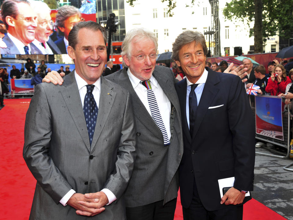 FILE - Actor Ben Cross, from left, British filmmaker Hugh Hudson, Nigel Havers appear at the Chariots of Fire Great British Premiere in London on July 10, 2012. Hudson, who debuted as a feature director with the Oscar-winning Olympics drama “Chariots of Fire” and later made such well-regarded movies as “My Life So Far” and the Oscar-nominated “Greystroke,” died Friday in London. He was 86. (Photo by Jon Furniss/Invision/AP, File)
