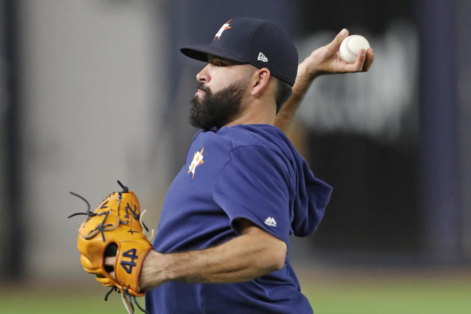 Houston Astros starting pitcher Jose Urquidy throws on the field during a brief workout, Monday, Oct. 14, 2019, at Yankee Stadium in New York, after arriving from Houston on an off day during the American League Championship Series against the New York Yankees. (AP Photo/Kathy Willens)