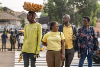 People watch as Secretary of State Antony Blinken's motorcade moves through Kinshasa, Congo, Tuesday, Aug. 9, 2022. Blinken is on a ten day trip to Cambodia, Philippines, South Africa, Congo, and Rwanda. (AP Photo/Andrew Harnik, Pool)