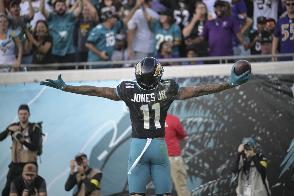 Jacksonville Jaguars wide receiver Marvin Jones Jr. (11) celebrates after a touchdown during the second half of an NFL football game against the Baltimore Ravens, Sunday, Nov. 27, 2022, in Jacksonville, Fla. (AP Photo/Phelan M. Ebenhack)