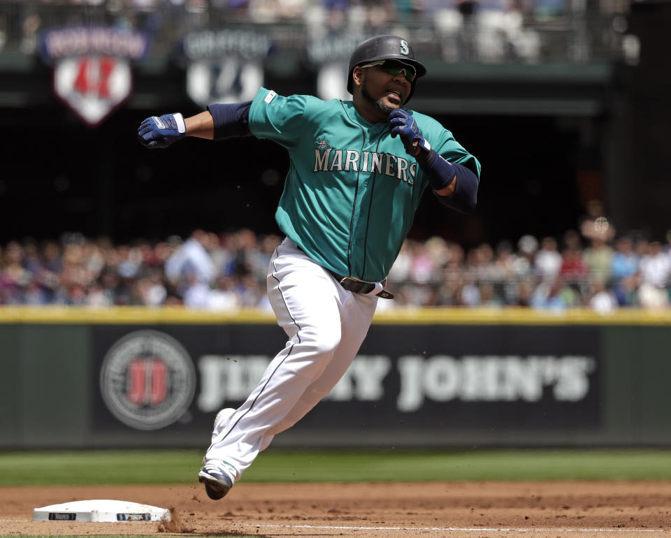 Seattle Mariners' Edwin Encarnacion rounds third on his way to score against the Houston Astros in the first inning of a baseball game Thursday, June 6, 2019, in Seattle. (AP Photo/Elaine Thompson)