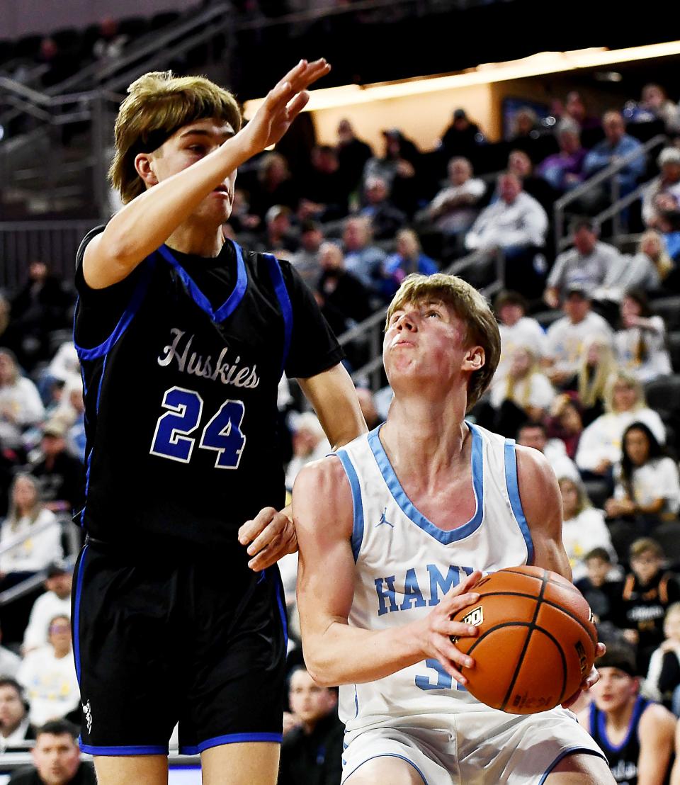 Hamlin's Tyson Stevenson drives against Elk Point-Jefferson's Levi Miller (24) during the third-place game of the state Class A boys basketball tournament on Saturday, March 18, 2023 at the Denny Sanford PREMIER Center in Sioux Falls.