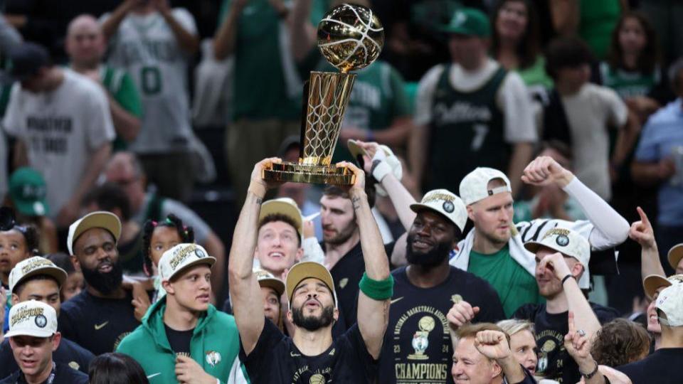 Jayson Tatum lifts the NBA title 