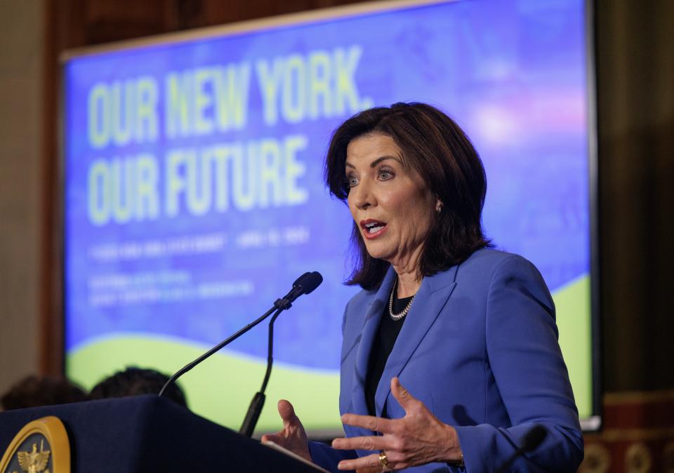 Gov. Kathy Hochul talks about the state budget on April 15. She pushed for the budget to require school districts to comply with the so-called "science of reading."