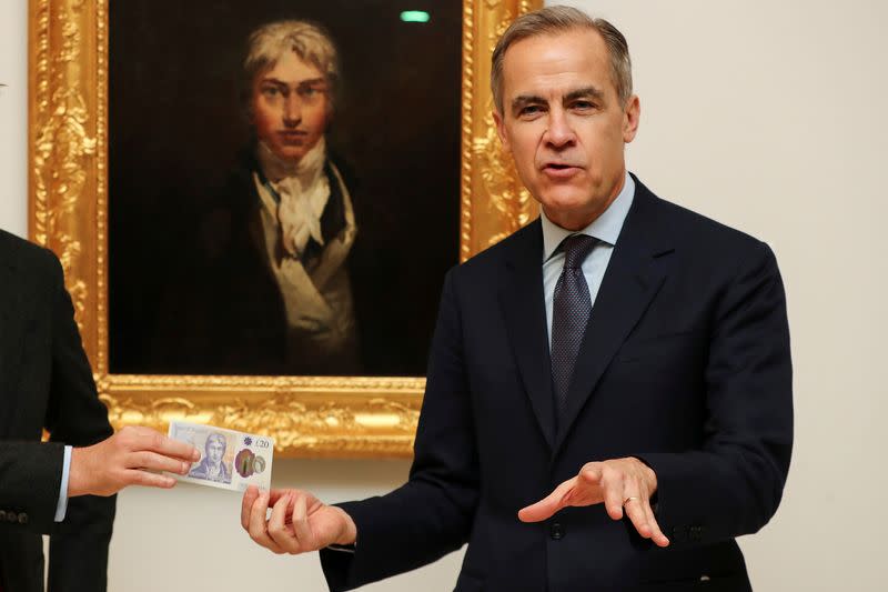 Mark Carney, Governor of the Bank of England poses with the new 20 pound note featuring artist JW Turner in front of Turner's self portrait at the Tate Britain in London