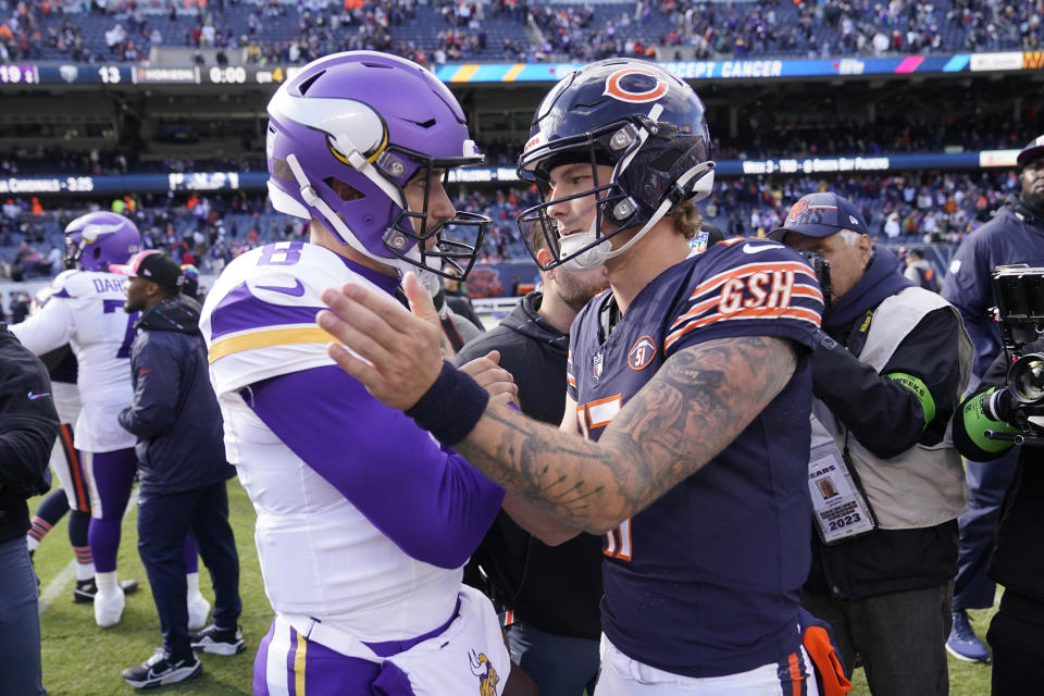 Minnesota Vikings quarterback Kirk Cousins, left, meets with Chicago Bears quarterback Tyson Bagent after an NFL football game, Sunday, Oct. 15, 2023, in Chicago. (AP Photo/Charles Rex Arbogast)