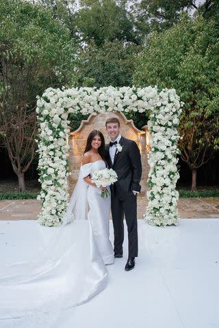 <p>Megan Kay Photography</p> Madison Prewett Troutt and Grant Troutt pose for a photo at their Dallas wedding in October 2022.
