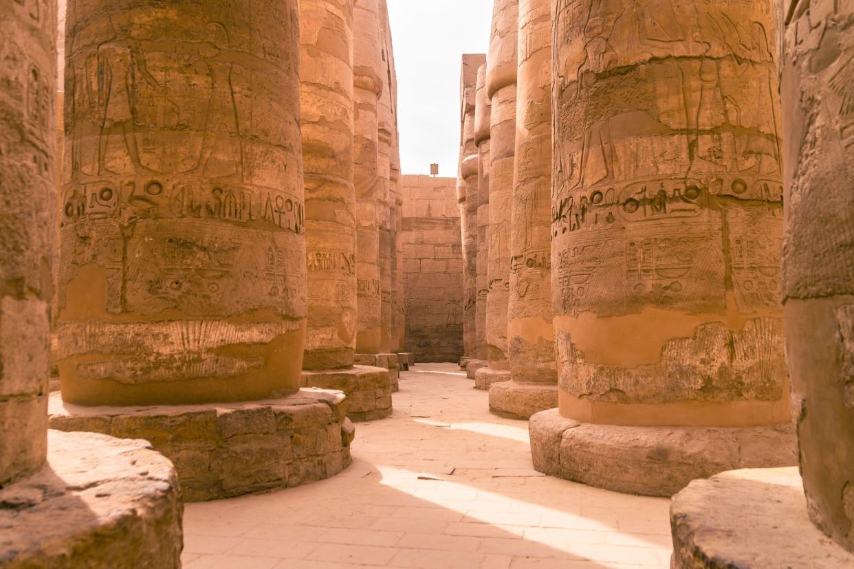 LUXOR, EGYPT  Ancient ruins of Karnak temple in Egypt at noon. The complex is a vast open-air museum, and the second largest ancient religious site in the world