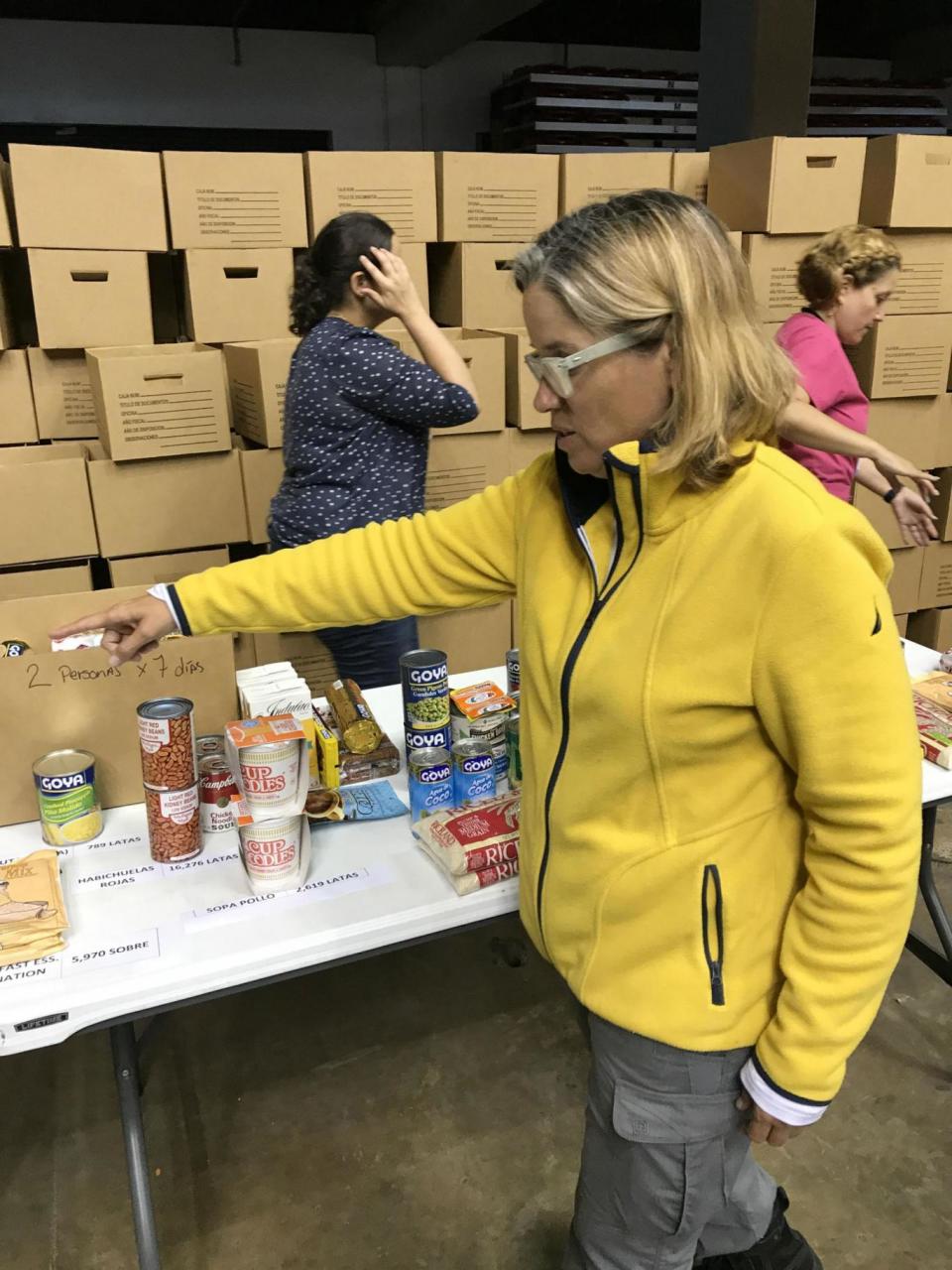 Mayor Carmen Yulin inspects donated food rations at the Coloseo Roberto Clemente in San Juanon the eve of President Trump's visit (David Usborne)