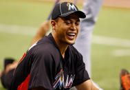 ST PETERSBURG, FL - JUNE 16: Outfielder Giancarlo Stanton #27 of the Miami Marlins stretches just before the start of the game against the Tampa Bay Rays at Tropicana Field on June 16, 2012 in St. Petersburg, Florida. (Photo by J. Meric/Getty Images)