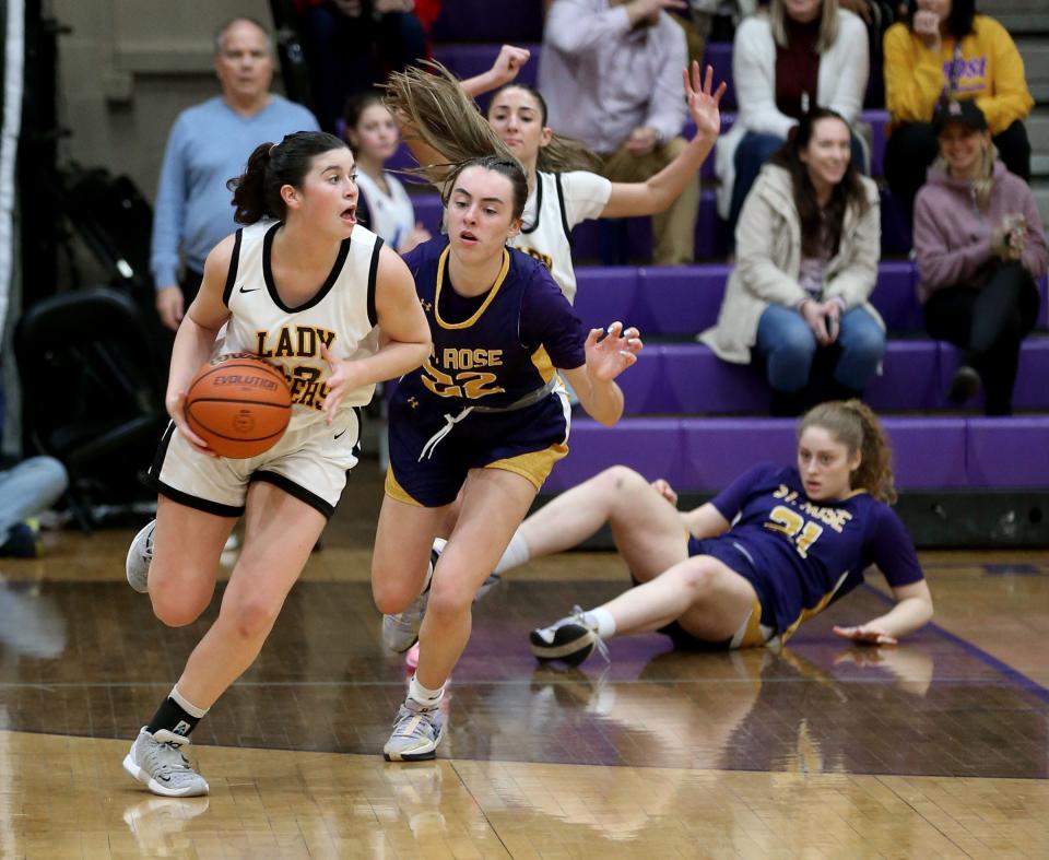 St. John Vianney's Julia Karpell (#13) moves the ball down the couyrt in front of St. Rose's Caroline Conforti (#22) during their game in Belmar Wednesday evening, January 31, 2024.