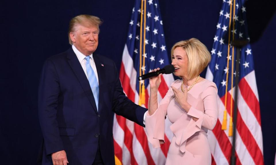 Trump with and Paula White in Miami this month.