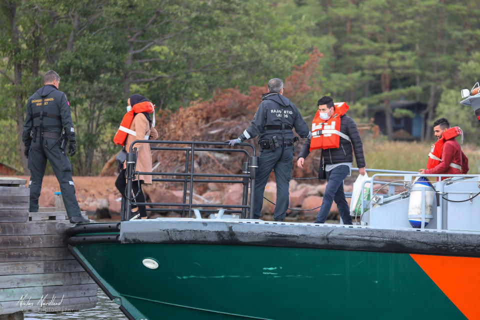 People are evacuated by boat from the Amorella cruise ship near the Aland islands, seen from Finland, Sunday, Sept. 20, 2020. Finnish authorities say a Baltic Sea passenger ferry with nearly 300 people has run aground in the Aland Islands archipelago between Finland and Sweden without injuries. (Niclas Norlund/Lehtikuva via AP)