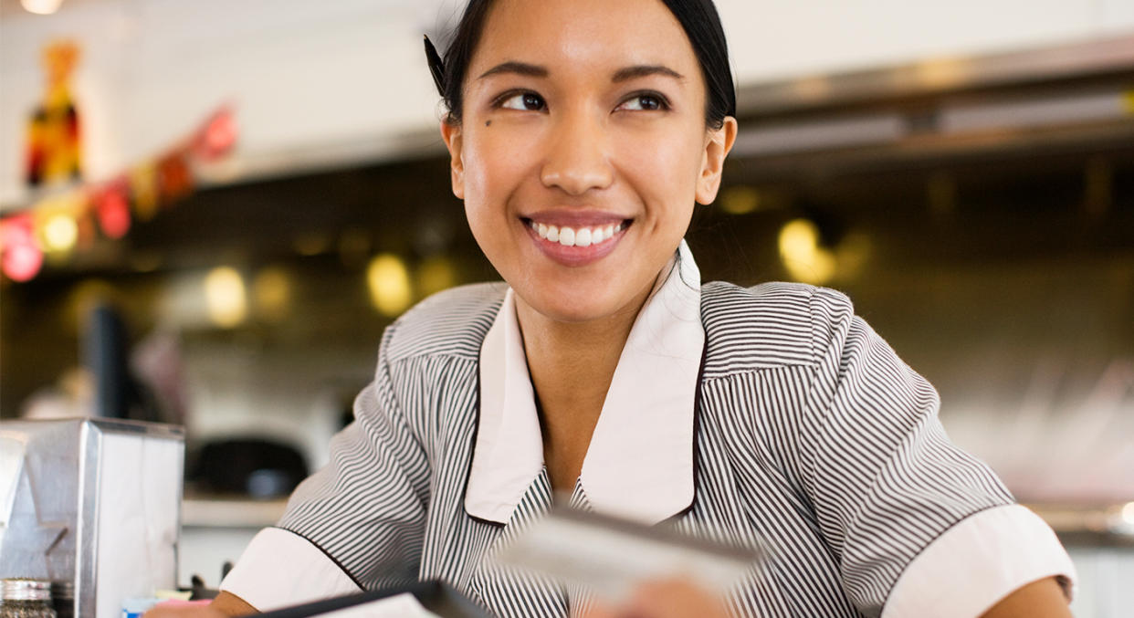 A pregnant waitress was pleasantly surprised by a customer’s large tip. [Stock image: Getty]