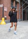 <p>The model look effortlessly cool in an oversized black blazer, a bucket hat, styled with a pair of white socks, fluffy blue UGG sheepskin slippers and carrying a black Yves Saint Laurent leather bag. </p><p><a class="link " href="https://www.selfridges.com/GB/en/cat/ugg-oh-yeah-shearling-sandals_R03811375/?previewAttribute=GREY%2FDARK" rel="nofollow noopener" target="_blank" data-ylk="slk:SHOP HAILEY'S SLIPPERS;elm:context_link;itc:0;sec:content-canvas">SHOP HAILEY'S SLIPPERS</a></p>