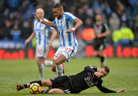 Soccer Football - Premier League - Huddersfield Town vs Crystal Palace - John Smith's Stadium, Huddersfield, Britain - March 17, 2018 Crystal Palace's James McArthur in action with Huddersfield Town’s Mathias Jorgensen REUTERS/Peter Powell