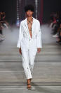 <p>A model walks the runway wearing a white jumpsuit during the I.AM.GIA show at Mercedes-Benz Fashion Week Australia Resort 19 Collections at Carriageworks on May 16, 2018, in Sydney, Australia. (Photo: Getty Images) </p>