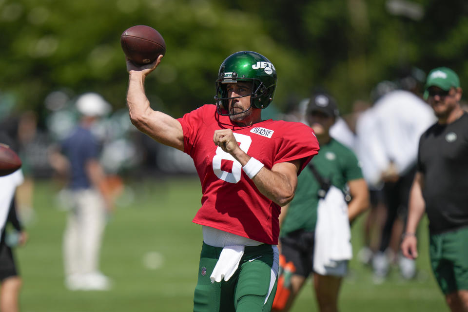 New York Jets quarterback Aaron Rodgers throws during a practice session at the NFL football team's training facility in Florham Park, N.J., Sunday, July 30, 2023. (AP Photo/Seth Wenig)