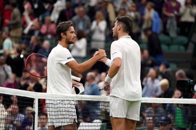 Cameron Norrie (right) and Tomas Machac shake hands at the net 