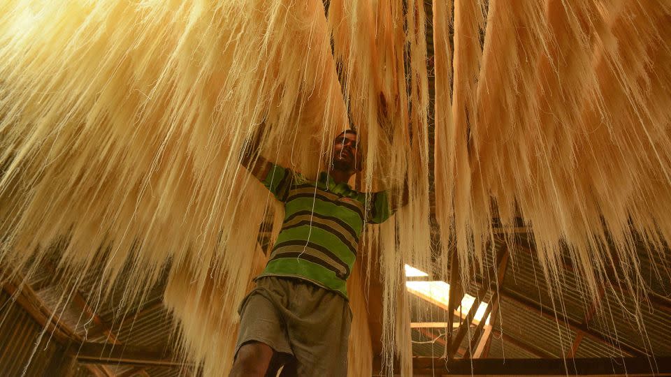 A worker arranges strands of vermicelli noodles to dry to make sheer khurma during Ramadan on the outskirts of Agartala, India, on May 24, 2018. - Arindam Dey/AFP/Getty Images