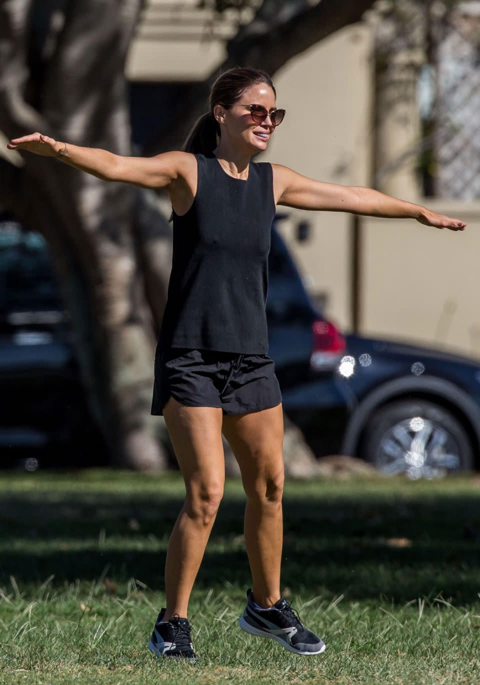 The Neighbours star wore an all-black workout ensemble. Source: INF