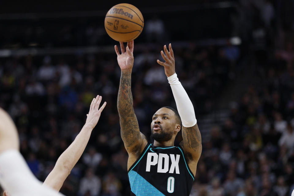Portland Trail Blazers guard Damian Lillard (0) shoots against the Utah Jazz in the firs half during an NBA basketball game, Wednesday, March 22, 2023, in Salt Lake City. (AP Photo/Jeff Swinger)