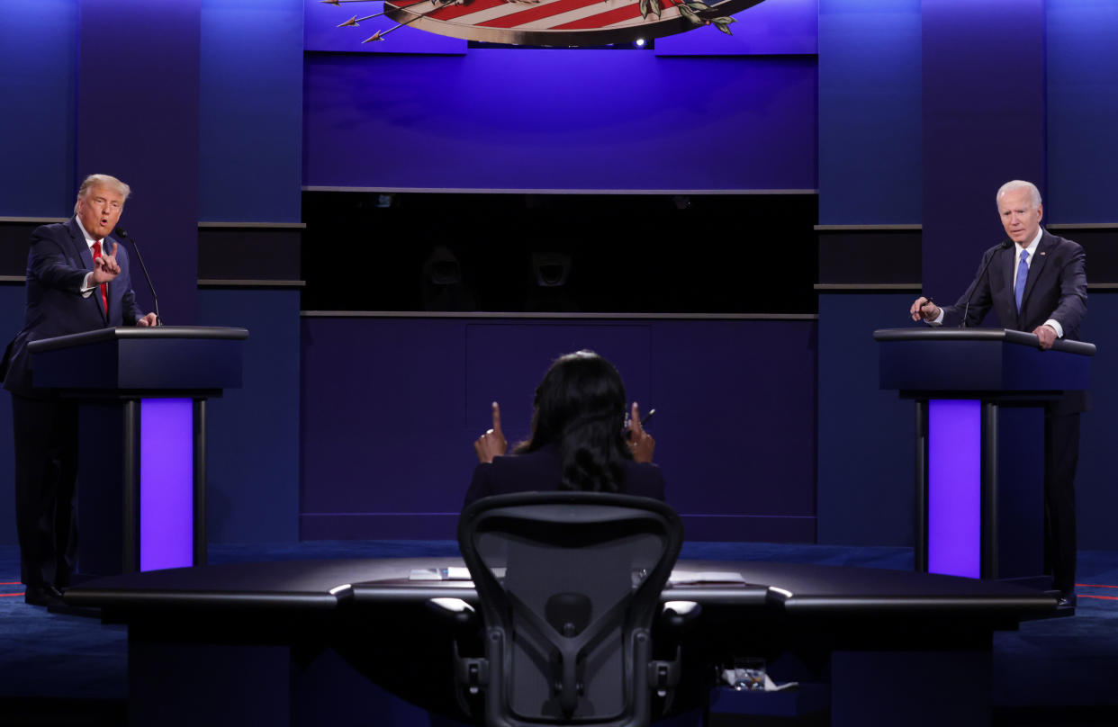 US President Donald Trump (L) Democratic Presidential candidate, former US Vice President Joe Biden and moderator, NBC News anchor, Kristen Welker (C) participate in the final presidential debate at Belmont University in Nashville, Tennessee, on October 22, 2020. (Photo by Chip Somodevilla / POOL / AFP) (Photo by CHIP SOMODEVILLA/POOL/AFP via Getty Images)