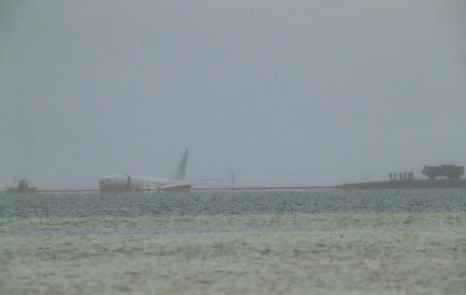 A downed U.S. Navy aircraft is seen in Kaneohe Bay, Monday, Nov. 20, 2023, in Kaneohe, Hawaii. (Jamm Aquino/Honolulu Star-Advertiser via AP)