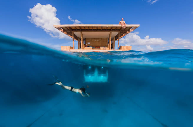 <p><strong>Where: </strong>Pemba Island, Tanzania</p> <p>Pemba, a verdant Indian Ocean island in the Zanzibar archipelago, has long been enticing divers with its pristine coral reefs and clear waters. Now the chic has taken the aquatic worship one step further, last month opening Africa’s first underwater hotel room. Submerged 13 feet underwater, the room has eight large, lit windows through which guests can gawk at a Technicolor parade of fish and cephalopods. A ladder leads to a sundeck and lounge.</p> <p><strong>Insider tip:</strong> Guests can have meals sent out to them by boat, such as grilled snapper with rosemary bread, followed by chocolate mousse and spiced pineapple.</p> <p><strong>Plan Your Trip: </strong>Visit </p>