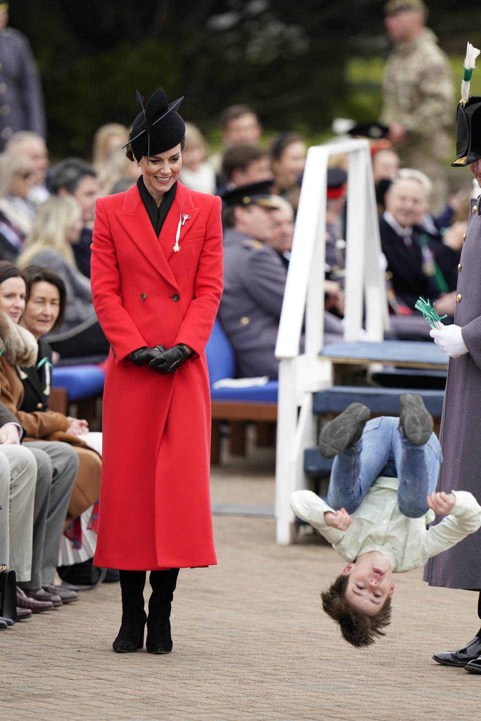 The Princess of Wales watches a young boy perfrom a back-flip at the St David's Day Parade during a visit to the 1st Battalion Welsh Guards at Combermere Barracks in Windsor, Berkshire. Picture date: Wednesday March 1, 2023. (Photo by Andrew Matthews/PA Images via Getty Images)