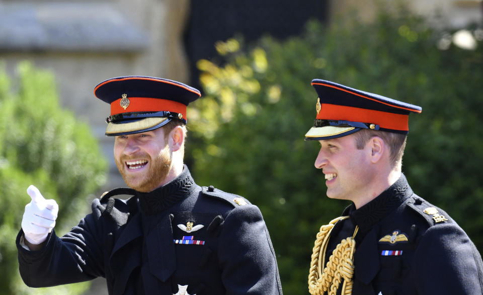 FILE - Britain's Prince Harry, left, reacts as he walks with his best man, Prince William the Duke of Cambridge, as they arrive for the the wedding ceremony of Prince Harry and Meghan Markle at St. George's Chapel in Windsor Castle in Windsor, near London, England, Saturday, May 19, 2018. Prince Harry has said he wants to have his father and brother back and that he wants “a family, not an institution,” during a TV interview ahead of the publication of his memoir. The interview with Britain’s ITV channel is due to be released this Sunday. (Ben Birchhall/pool photo via AP, File)