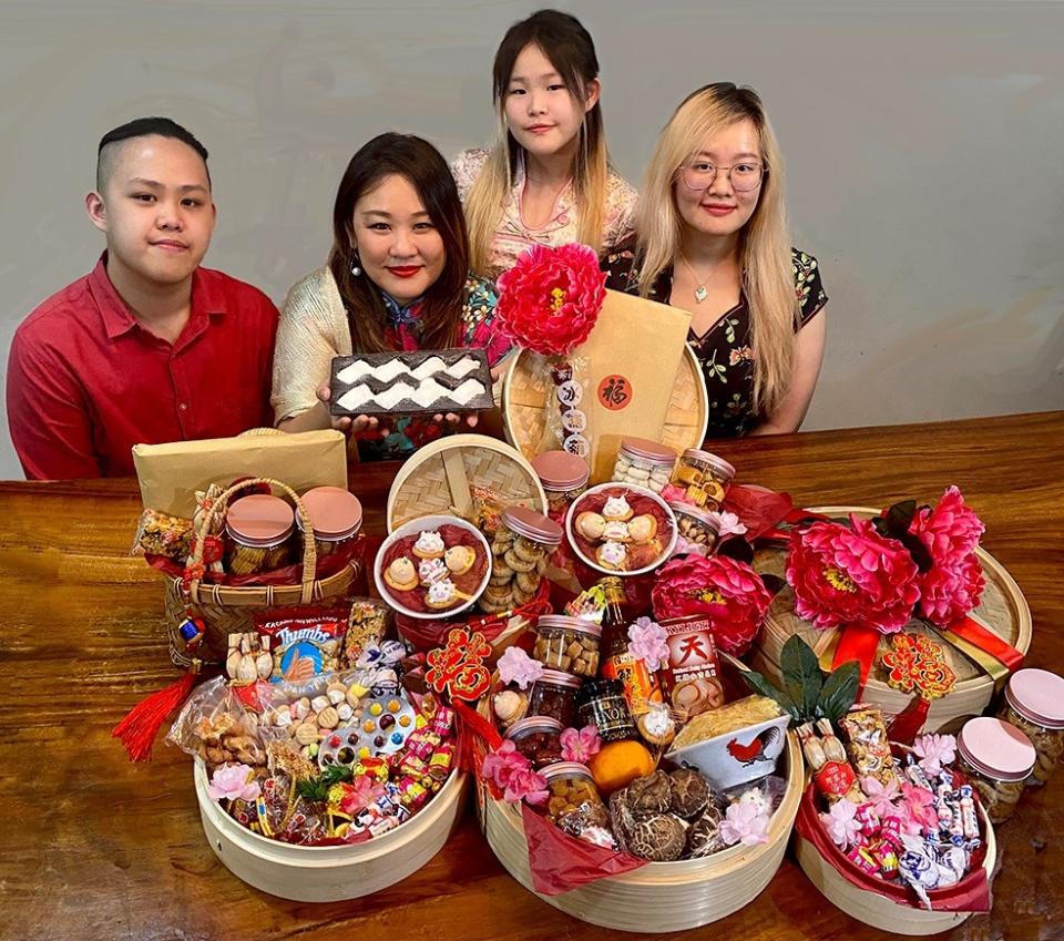 Former beauty pageant contestant Vanessa Yoong and her children — (from left) Jayden, Janelle (standing) and Joelle Yap — has come up with hampers that invoke nostalgic memories. — Photo courtesy of Vanessa Yoong