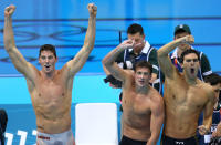 Conor Dwyer, Ryan Lochte and Ricky Berens applaud teammate Michael Phelps as he wins the gold in the Men's 4 x 200m Freestyle Relay final on Day 4 of the London 2012 Olympic Games at the Aquatics Centre on July 31, 2012 in London, England. (Photo by Streeter Lecka/Getty Images)