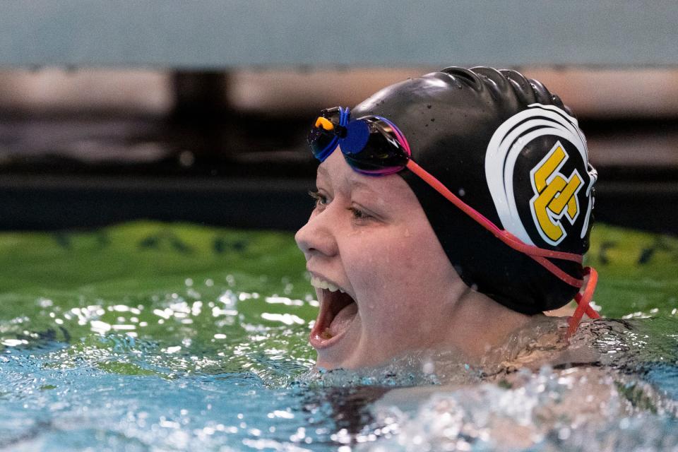 Karsyn Smith of Union High School celebrates after competing in the women’s 200 free at swimming preliminaries for state championships at BYU’s Richards Building in Provo on Friday, Feb. 16, 2024. | Marielle Scott, Deseret News