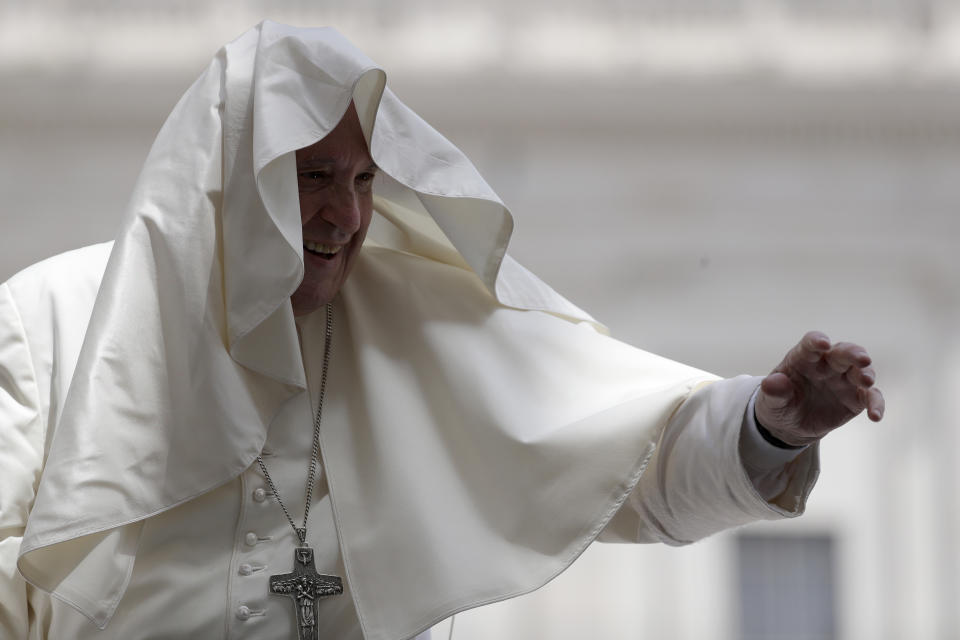 Pope Francis' mantle is blown by the wind during his weekly general audience in St. Peter's Square, at the Vatican, Wednesday, June 12, 2019. (AP Photo/Gregorio Borgia)