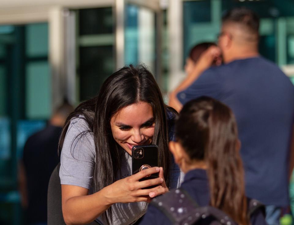 Students take photos on the first first day of school on Monday outside Paul C. Moreno Elementary School in Central El Paso.