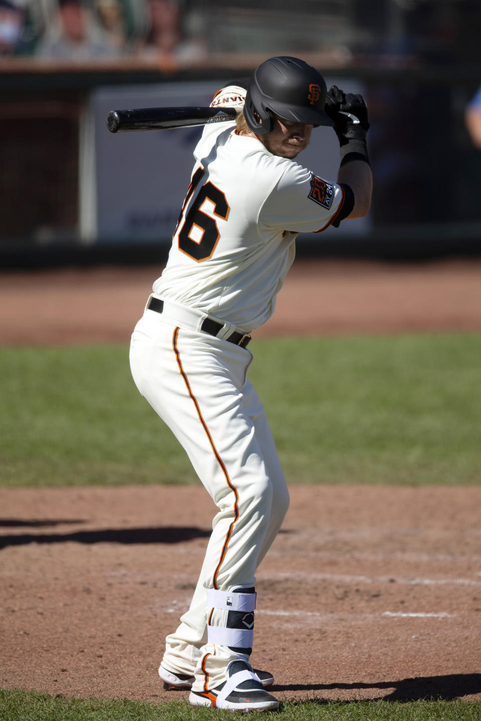 San Francisco Giants pinch-hitter Justin Smoak (46) stands near the play while making his debut with the team, during the sixth inning of the Giants' baseball game against the Seattle Mariners, Thursday, Sept. 17, 2020, in San Francisco. (AP Photo/D. Ross Cameron)