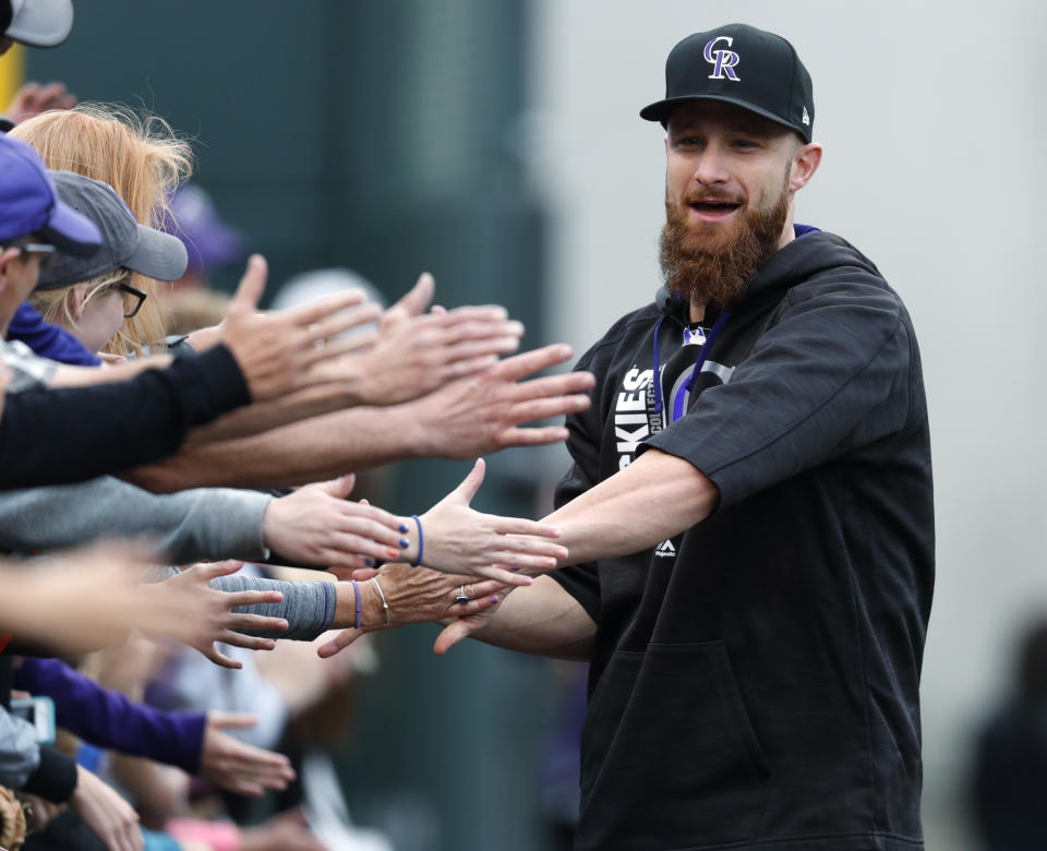 New Athletics catcher Jonathan Lucroy will be smiling at the trade deadline. (AP Photo/David Zalubowski)